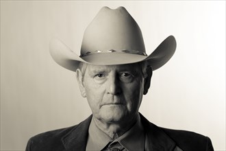 Serious man wearing cowboy hat