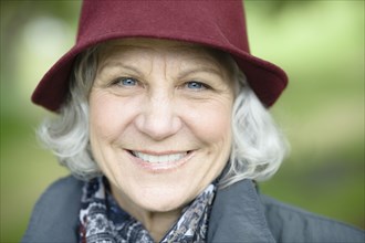 Smiling senior Caucasian woman in hat
