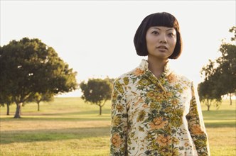 Portrait of Asian woman in meadow