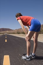 Mixed Race female runner on road