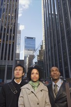 Multi-ethnic businesspeople in urban scene