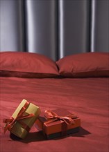 Close up of gifts on bed
