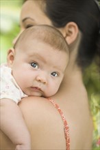 Hispanic mother holding baby