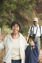 Multi-ethnic senior couple hiking