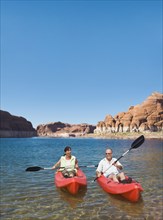 Multi-ethnic seniors kayaking
