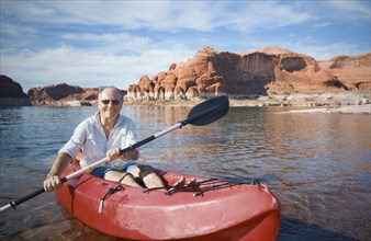 Senior man sitting in kayak
