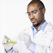 African American scientist working with petri dish
