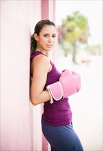 Hispanic woman in boxing gloves