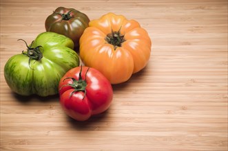 Four colorful tomatoes