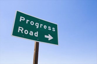 Sign with arrow toward Progress Road