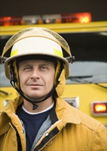 Caucasian firefighter wearing uniform and helmet