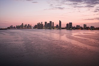 Miami city skyline and harbor at sunset