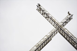 Low angle view of crane ladders