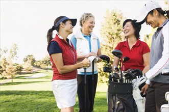 Women talking on golf course
