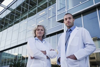 Serious doctors standing outdoors