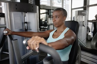 African American woman exercising in health club