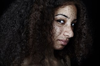 Freckled mixed race woman