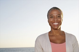 Black woman smiling outdoors