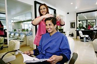 Woman having hair cut in salon