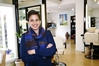Hispanic woman smiling in salon