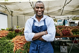 Black man working at outdoor market