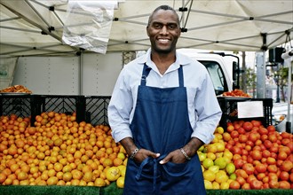 Black man working at outdoor market