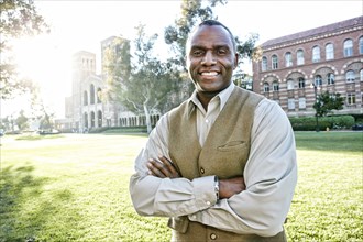 African American professor smiling on campus