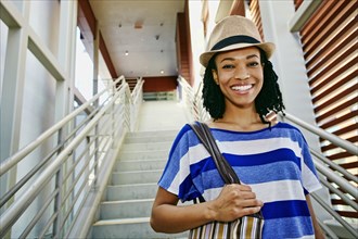 Black woman walking down steps