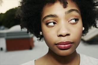 Mixed race woman arching an eyebrow
