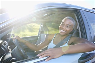 Black woman driving car