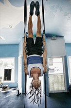 Asian man exercising in gym