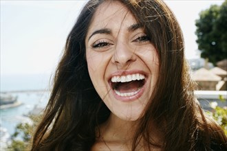 Close up of mixed race woman laughing
