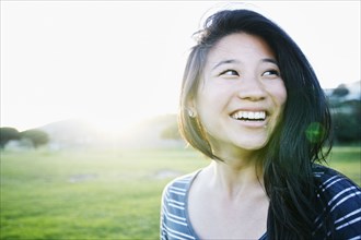 Chinese woman smiling outdoors