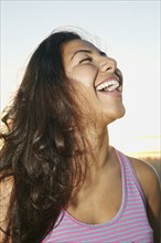 Close up of Hispanic woman laughing