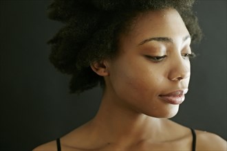 Close up of smiling black woman looking down