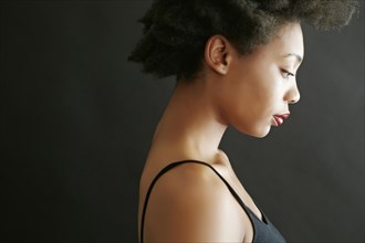 Close up profile of black woman looking down