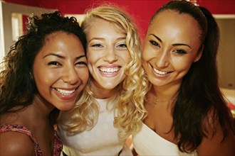 Close up of women smiling together