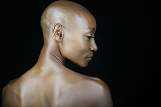 African American woman looking over her shoulder