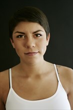 Close up of Hispanic woman with serious expression