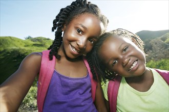 Black girls smiling outdoors