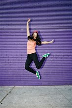 Asian woman jumping for joy