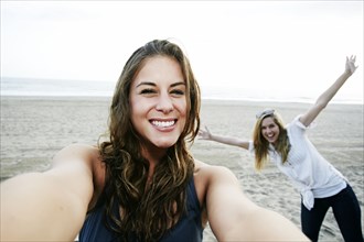 Women taking selfie on beach