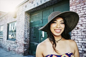 Japanese woman smiling outdoors