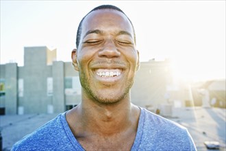 African American man smiling outdoors