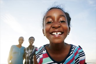 Black girl smiling outdoors