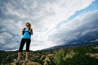 Caucasian woman standing on rural hilltop