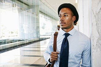 Black businessman standing in office lobby