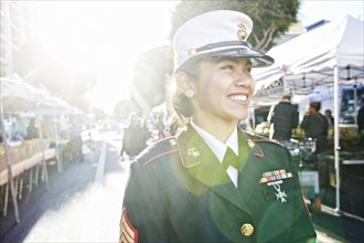 Asian soldier smiling in farmers market