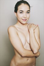 Portrait of naked Hispanic woman
