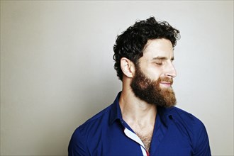 Caucasian man with beard with eyes closed